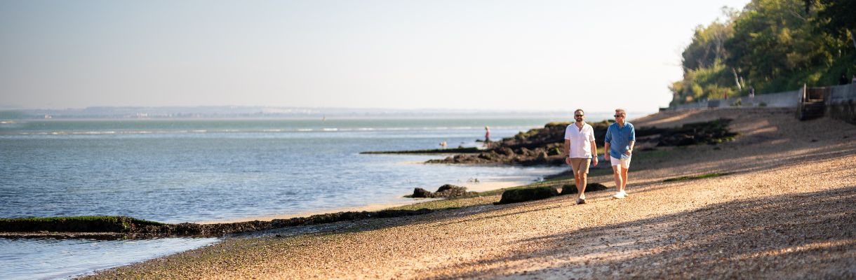 Two men walking on Isle of Wight beach